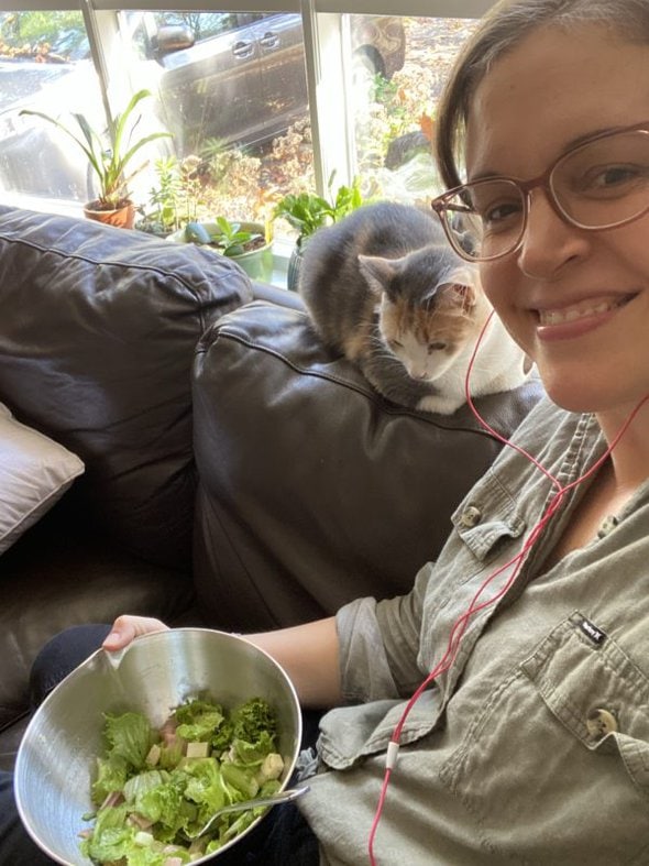 Kristen eating a salad.