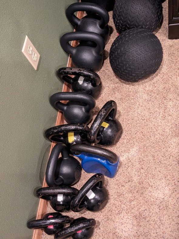 kettlebells against a wall.