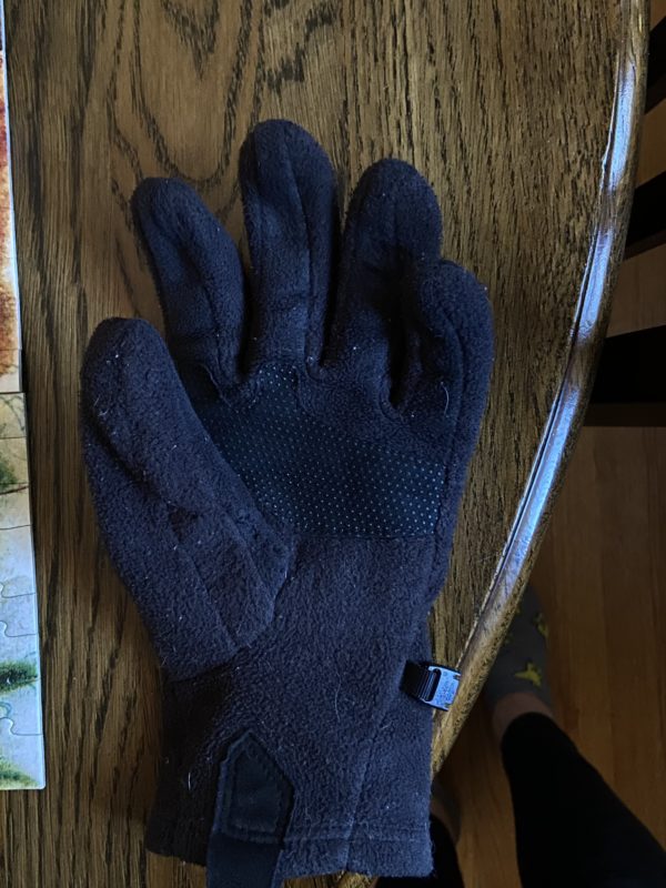 mended black glove.