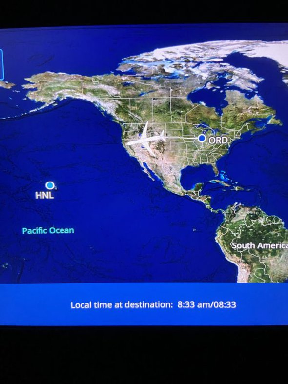 flight tracker screen on plane.