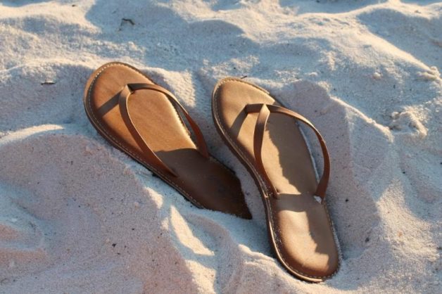 flip flops in sand.