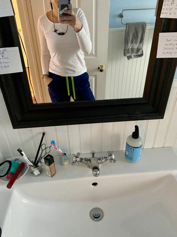 Kristen in scrub pants.