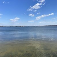 river under a blue sky.