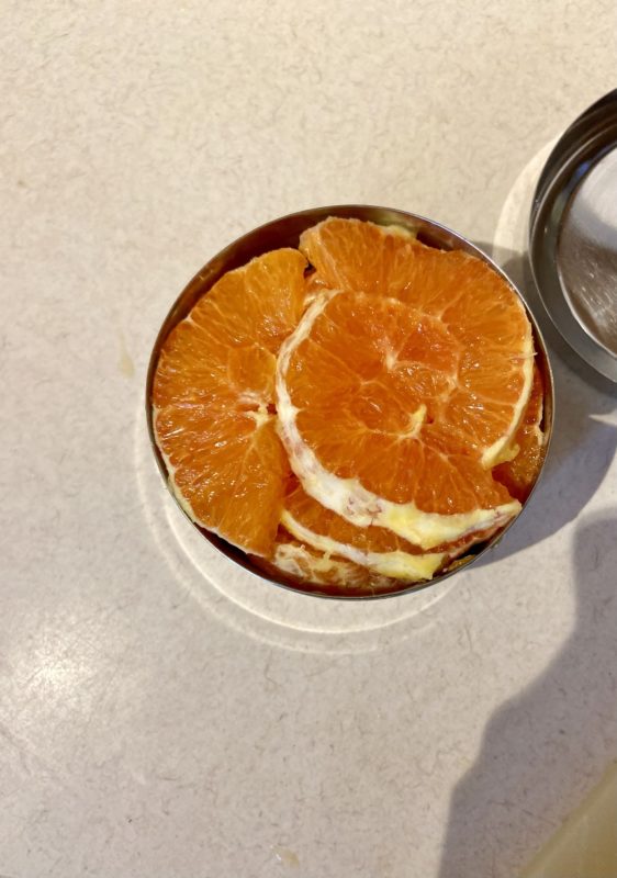 oranges in a metal container.