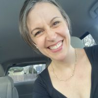 Kristen in a black dress.