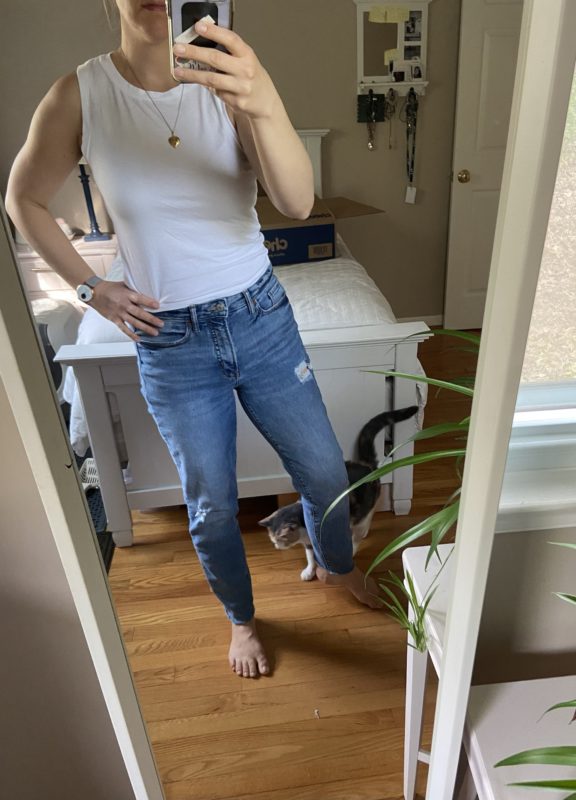 Kriste in jeans and a white shirt.