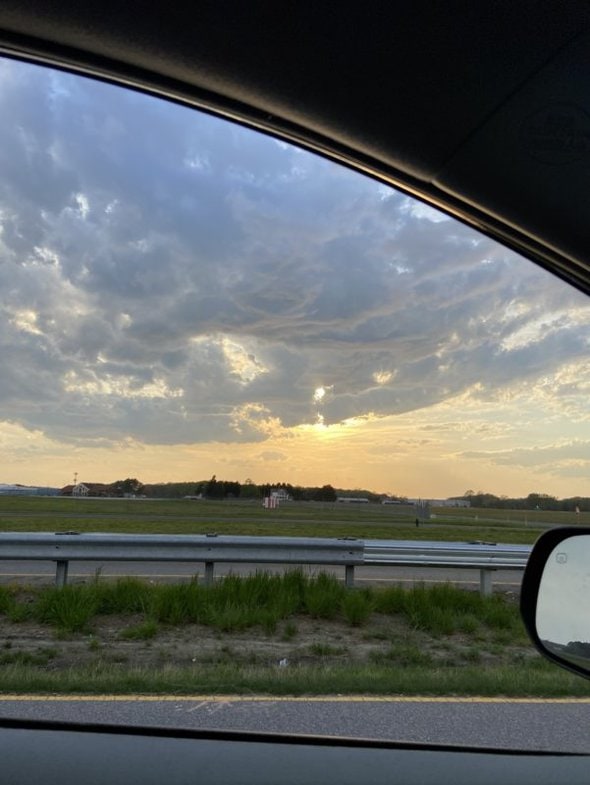 sunset over farm land.