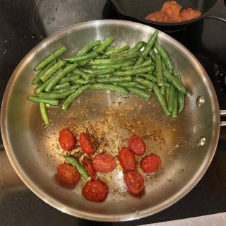 beans and tomatoes in a pan.