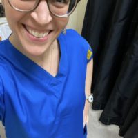 Kristen in a blue scrub top.