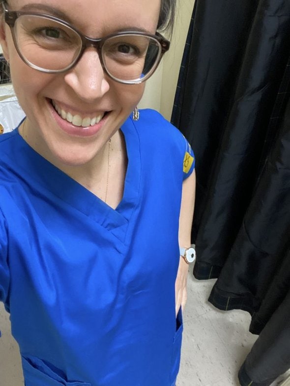 Kristen in a blue scrub top.