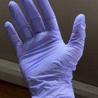 glove on Kristen's hand.