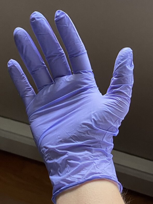 glove on Kristen's hand.