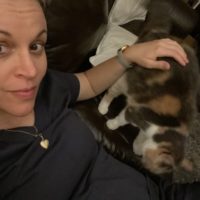 Kristen and chiquita on a couch.