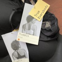 two black bras with tags attached.