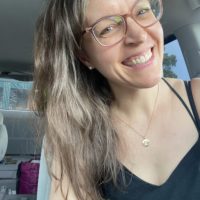 Kristen in a black dress.