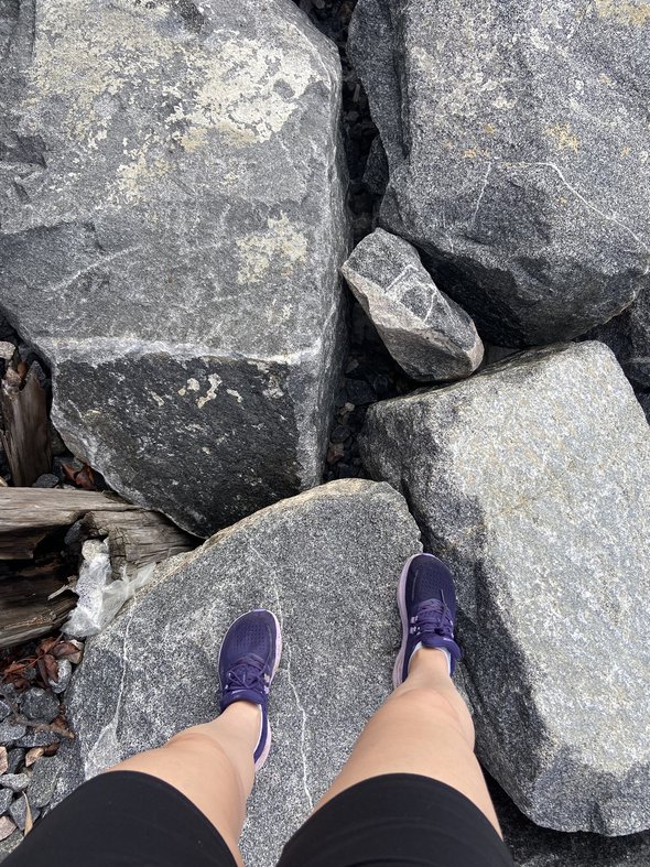 running shoes on rocks.