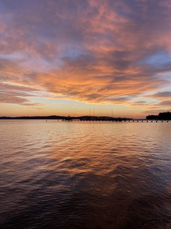 sunrise over the water.