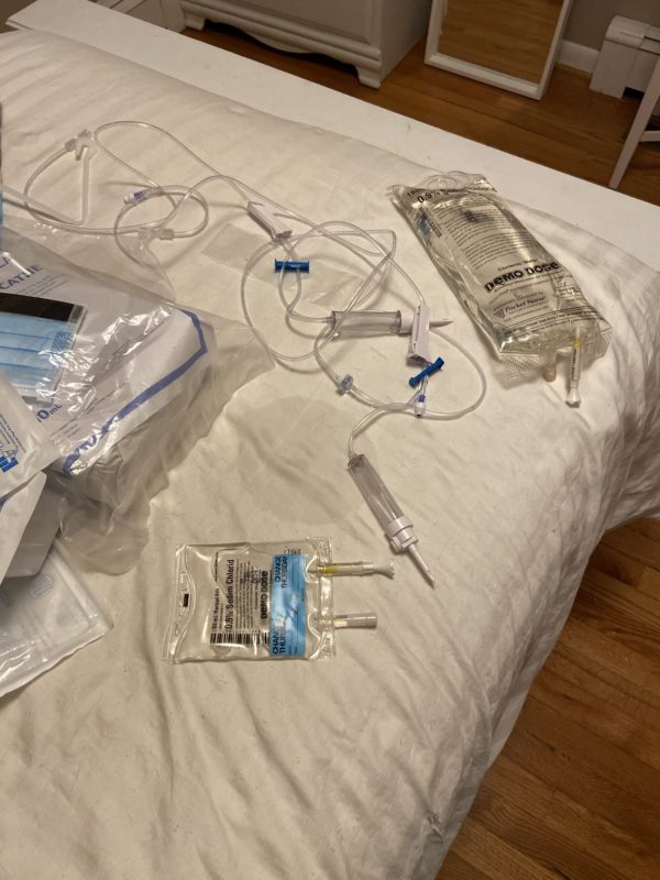 IV supplies on a bed.