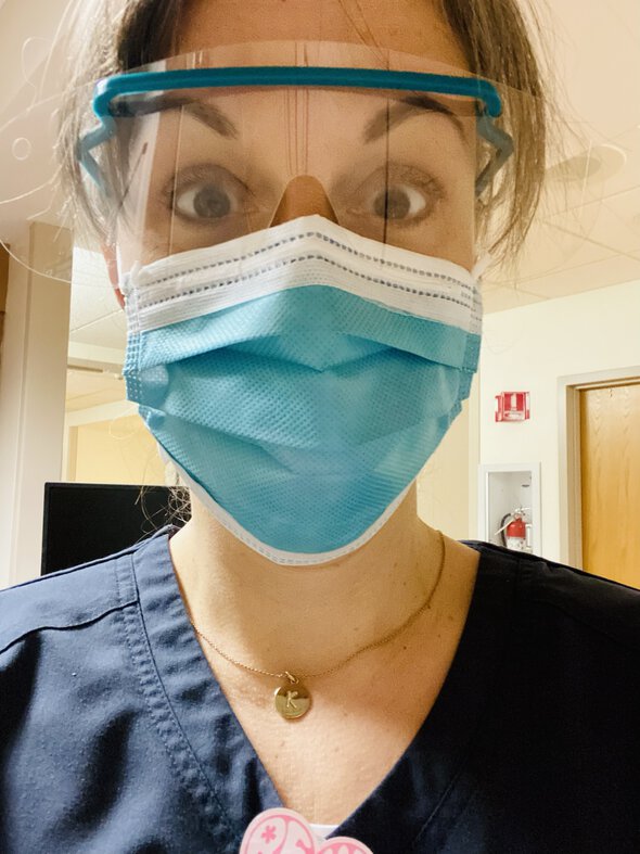 Kristen in a mask and glasses.