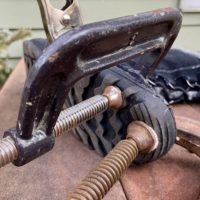 shoe repair held in with clamps.