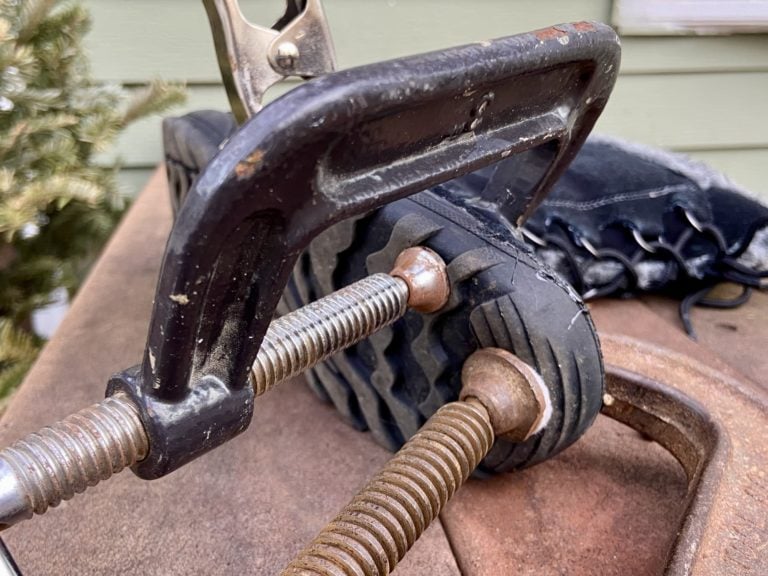 shoe repair held in with clamps.