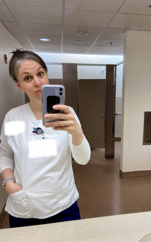 Kristen in scrubs.