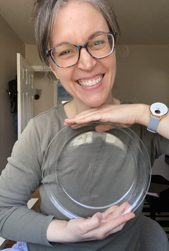 Kristen holding a pie plate.