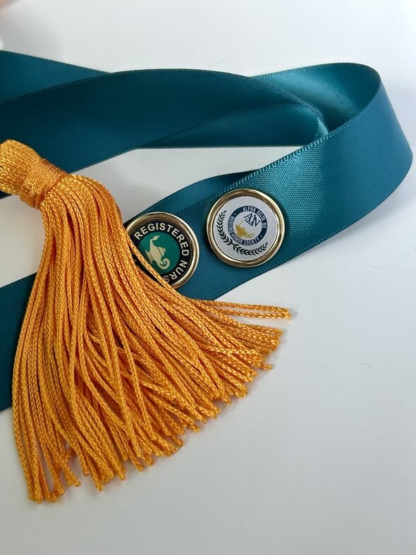 nursing pins and cord.