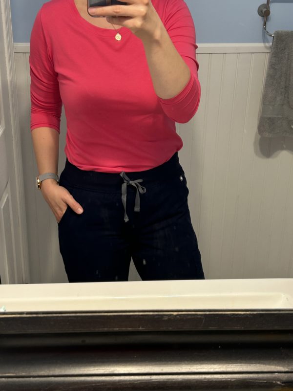 Kristen in scrub pants.