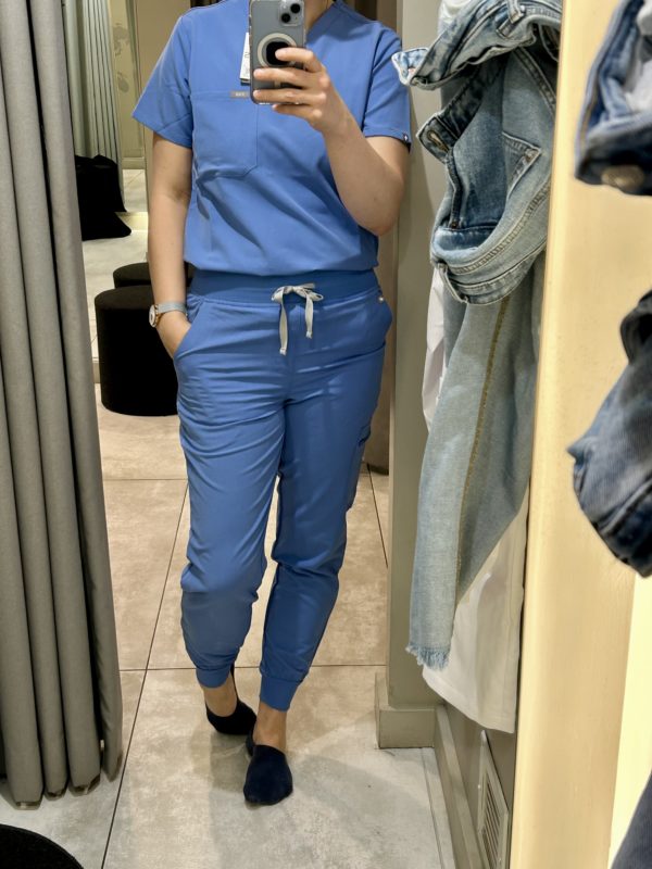 Kristen in blue scrubs.
