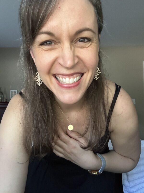 Kristen in black dress.