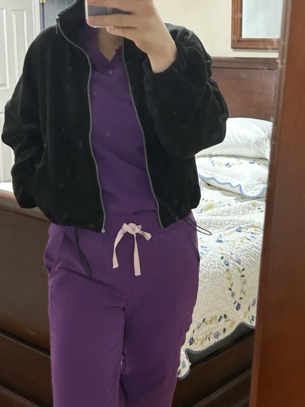 Kristen in purple scrubs.