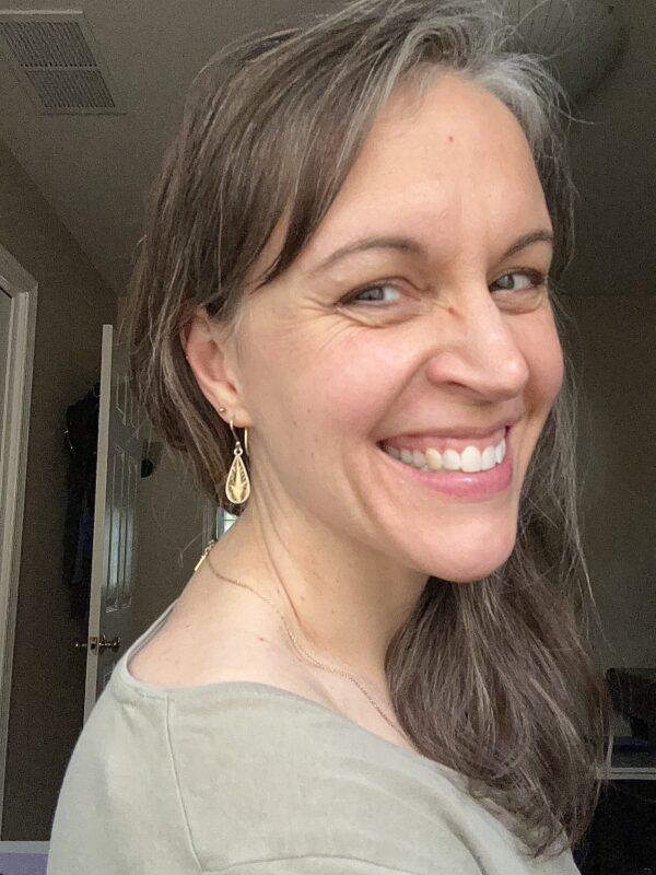 Kristen with ear piercings.