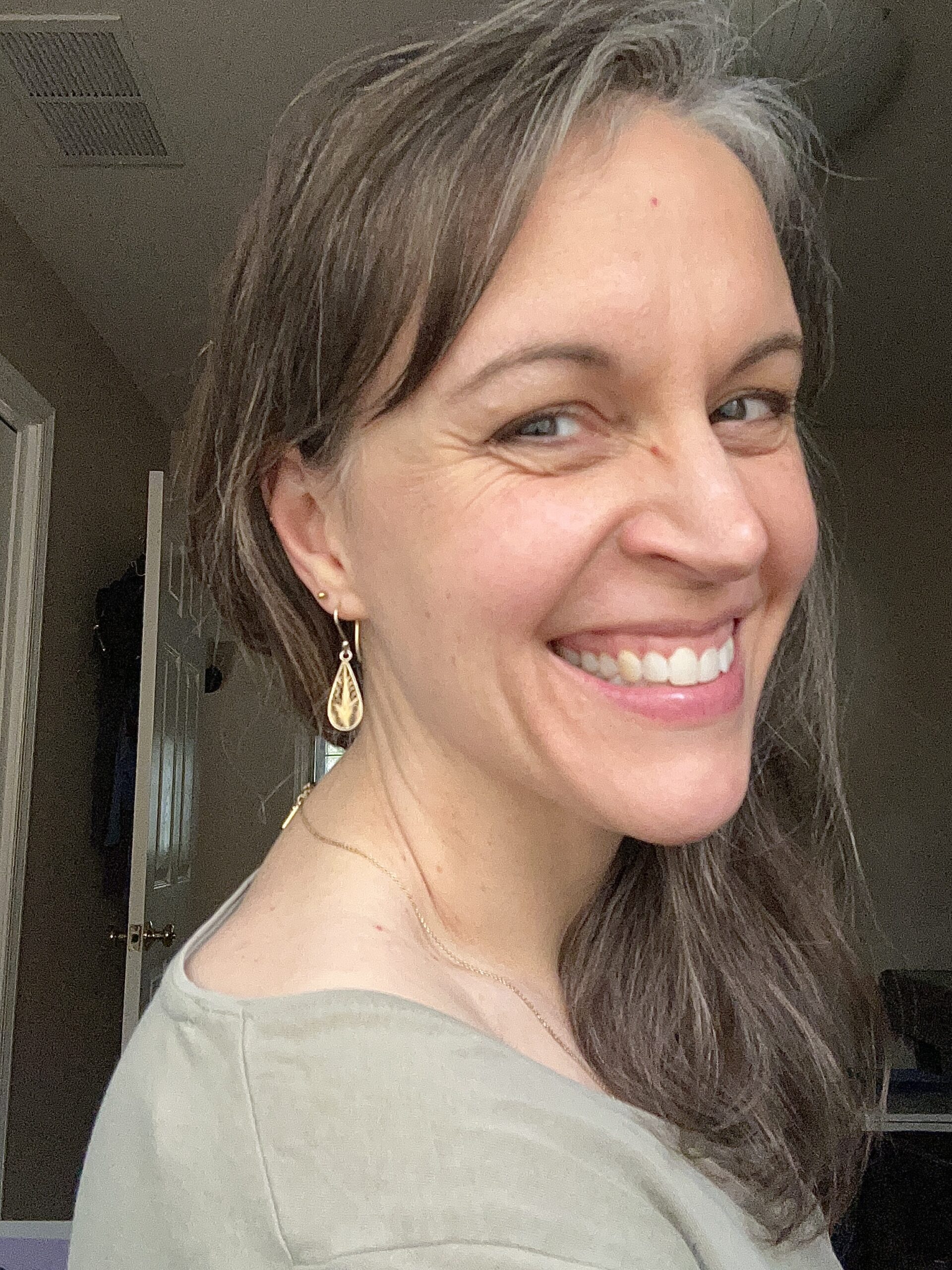 Kristen with ear piercings.