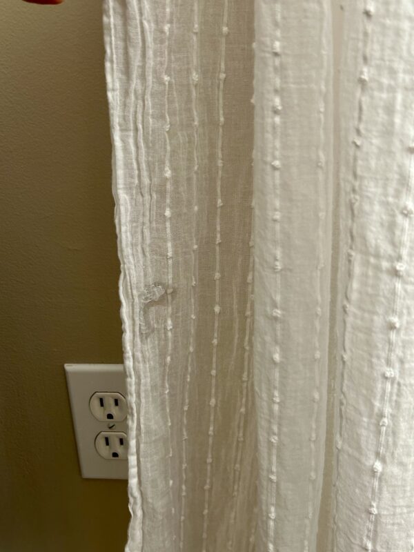 fray check on curtain.