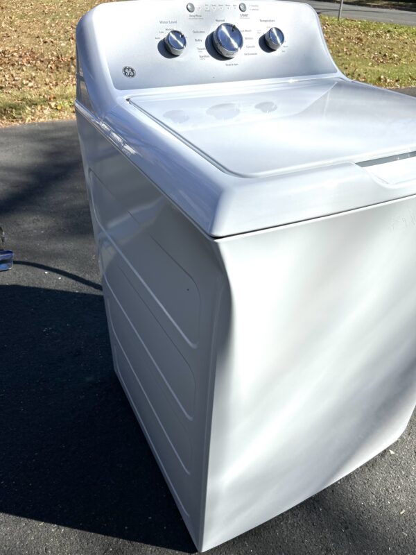 dented washing machine.