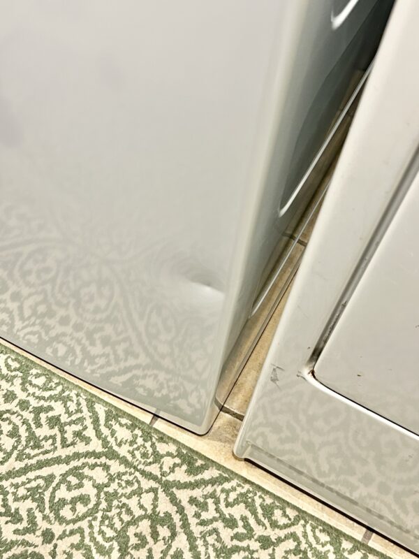 dented washing machine.