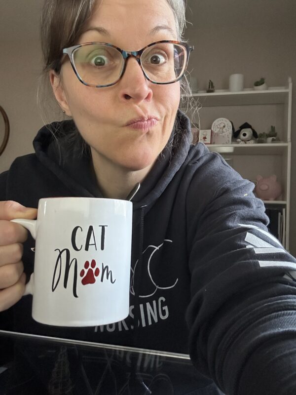 Kriste holding a mug.