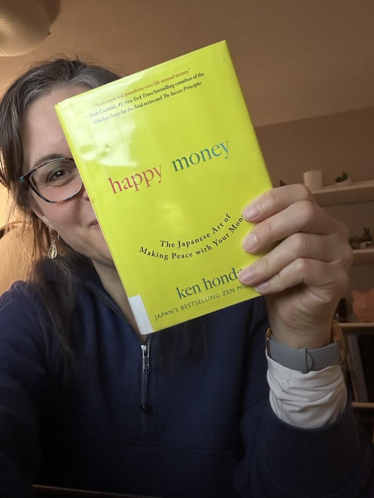 Kristen holding a book.