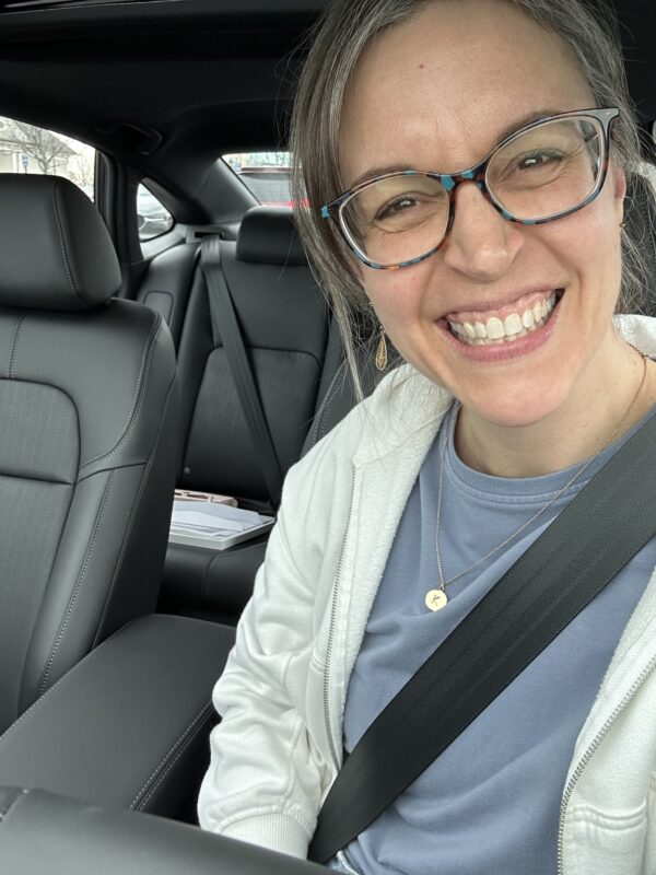 Kristen in a new car.