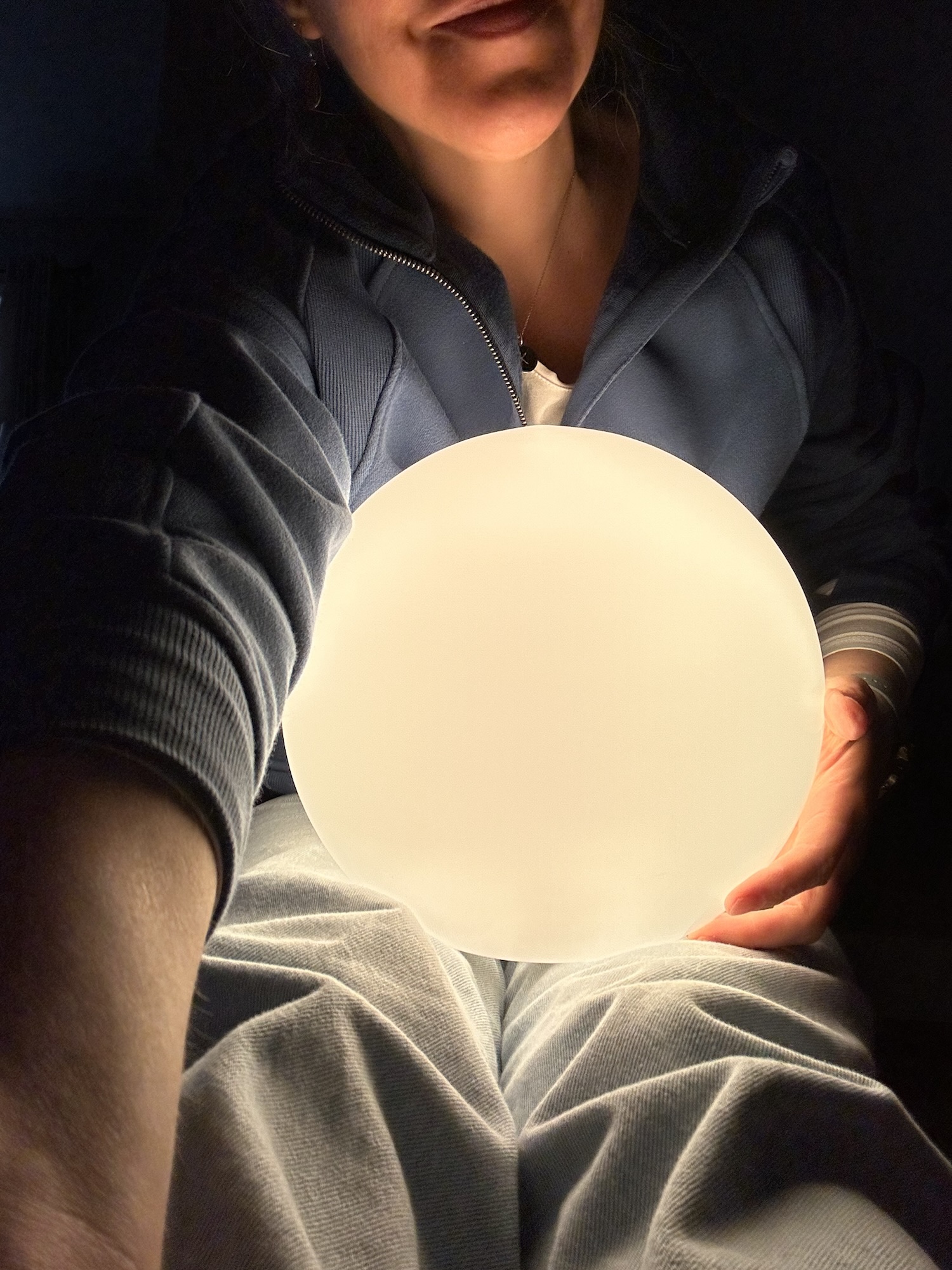 Kristen holding a lamp.