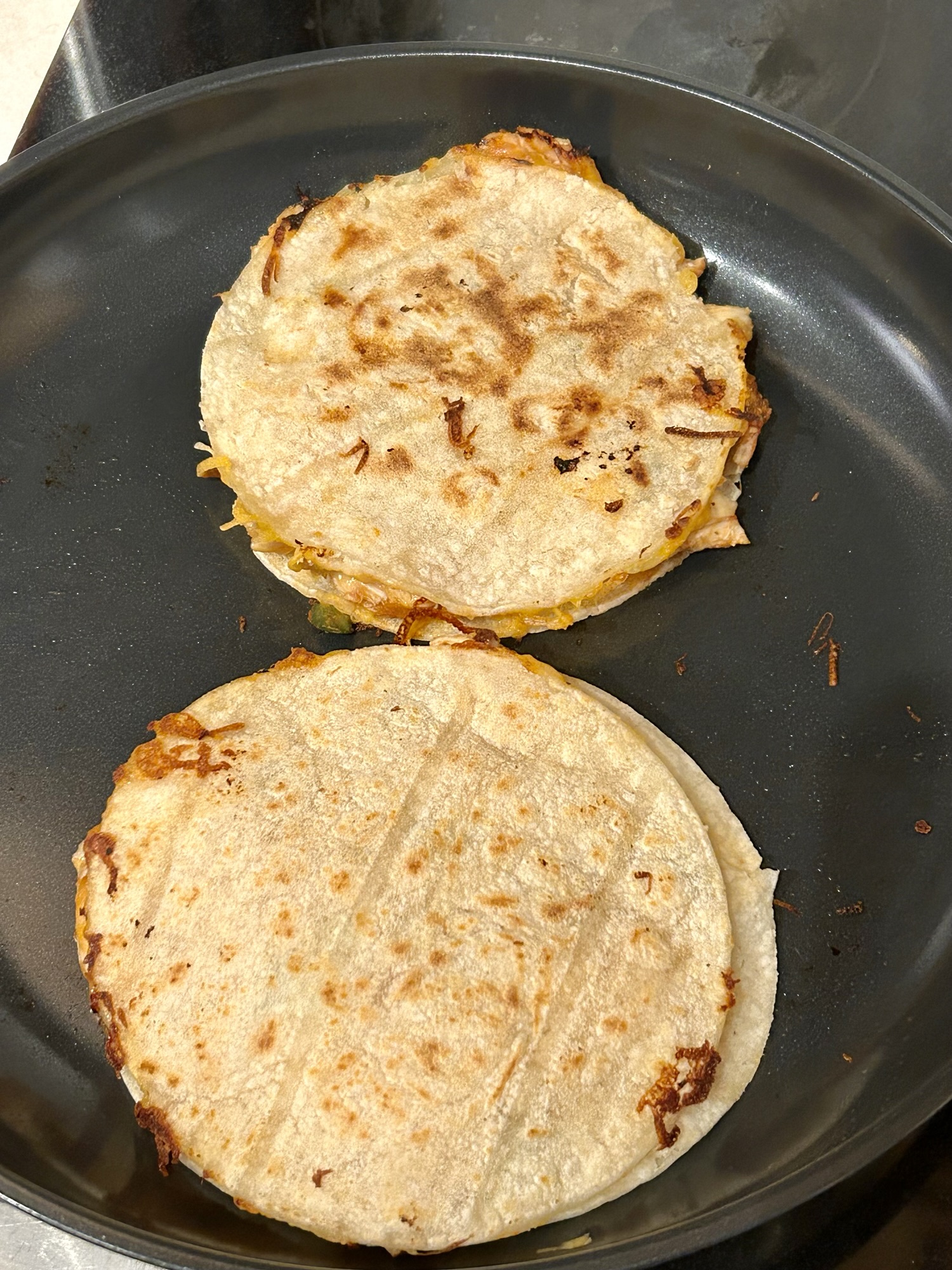 quesadillas in a skillet.