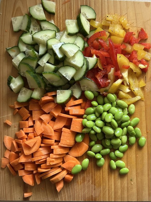 sliced veggies on a cutting board.