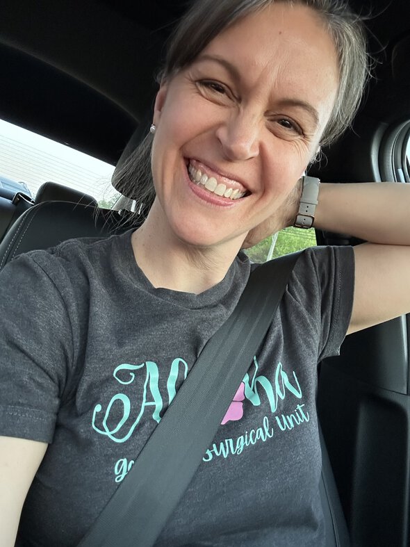 Kristen in a work tshirt.