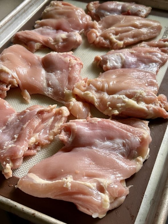 chicken on a baking sheet.