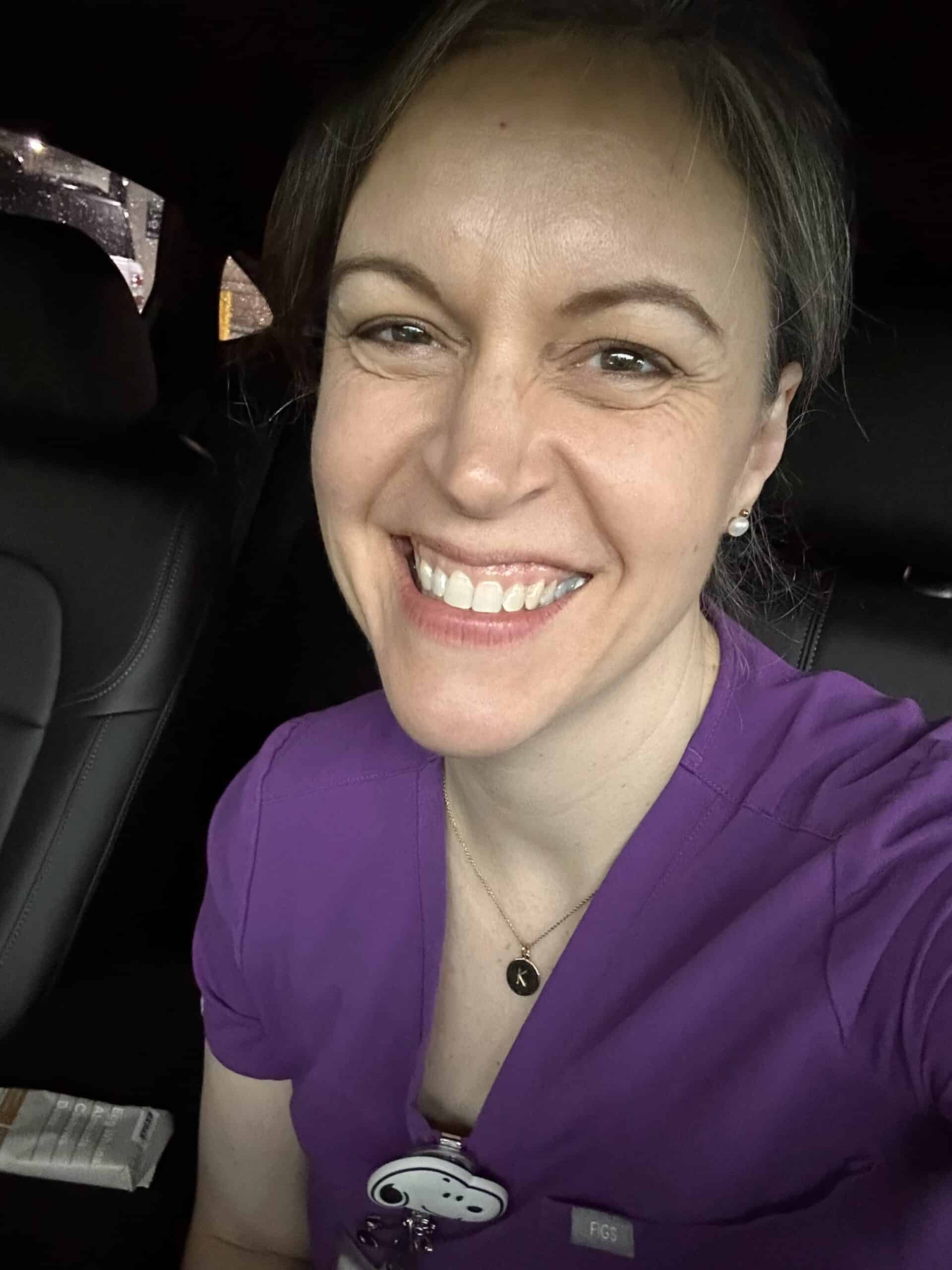 Kristen in scrubs.