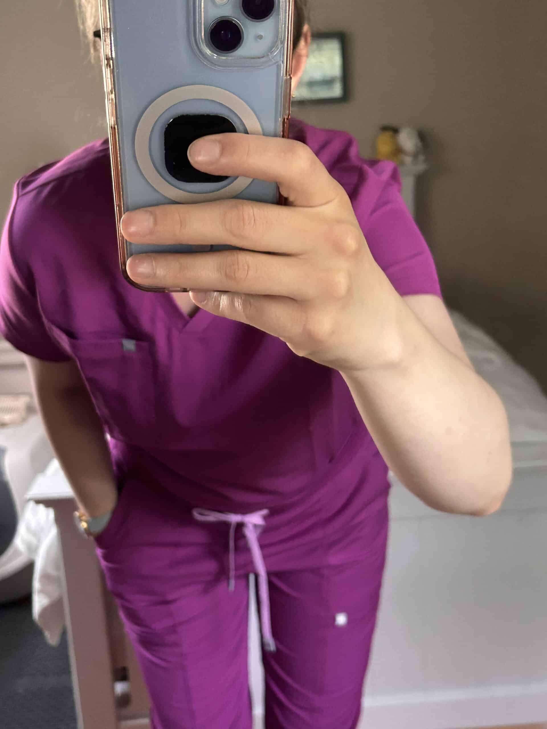 Kristen in pink scrubs.