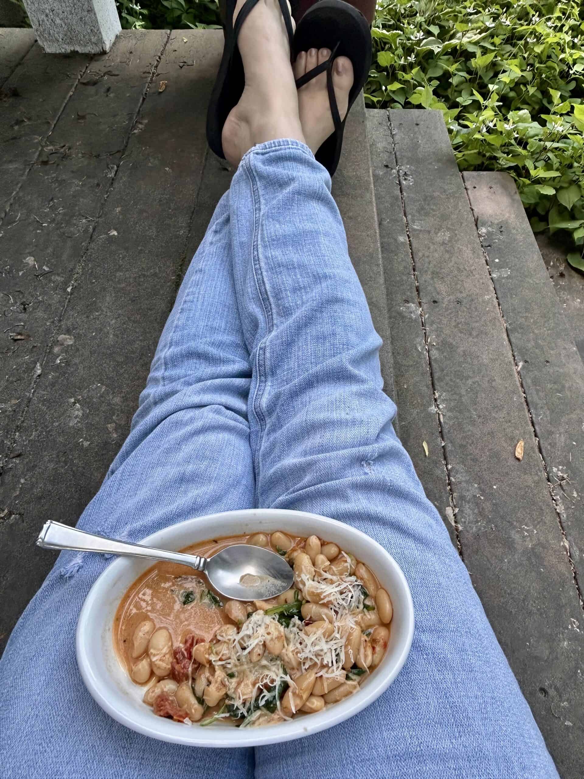 Kristen eating outside.
