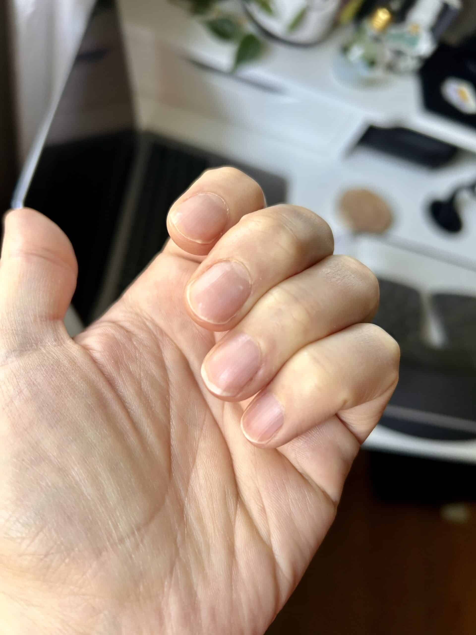 Kristen's bare fingernails.