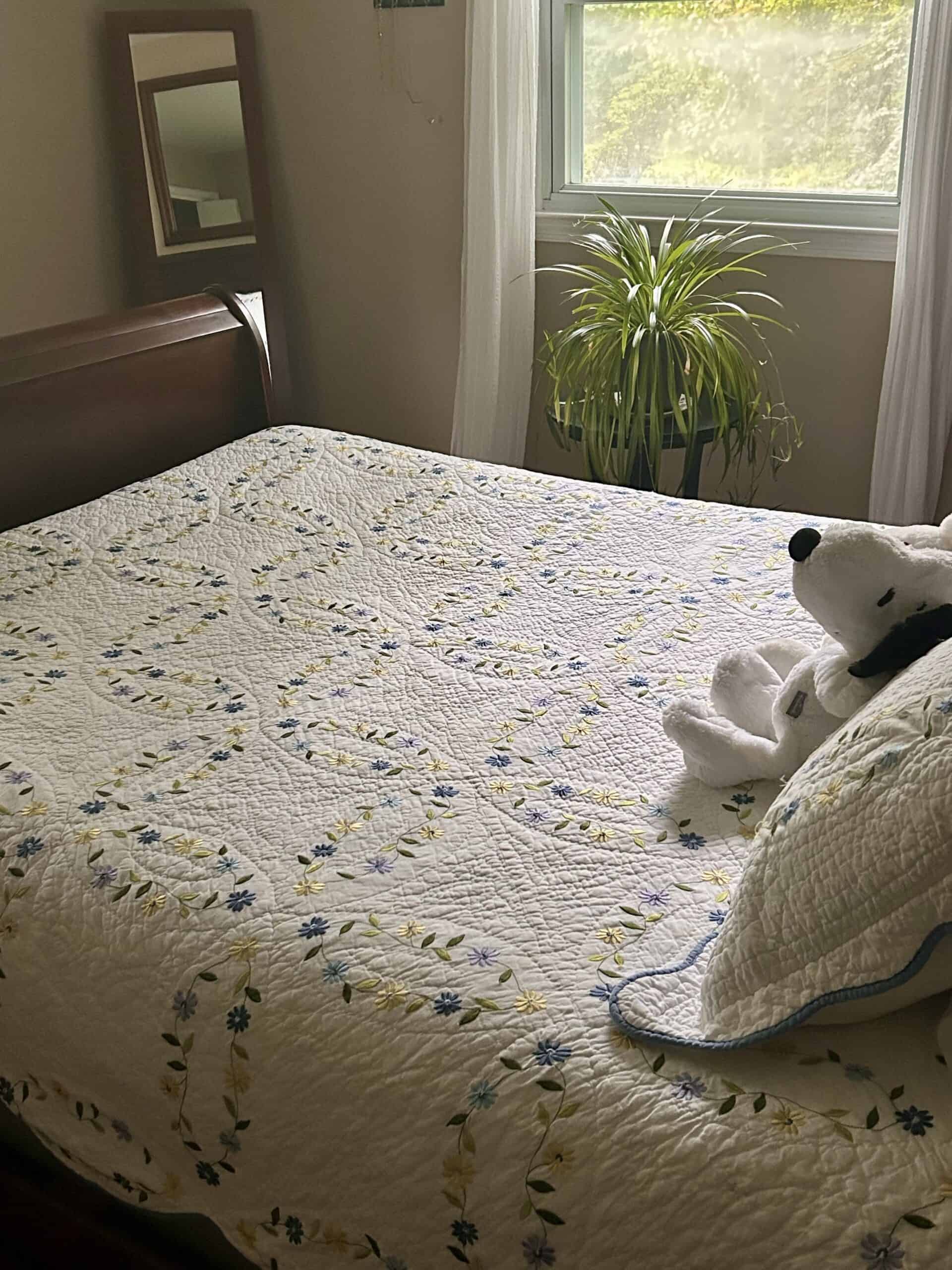 quilt on bed.